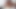 Lascivious black girl using her vibrator to pleasure a sexy girl on the bed