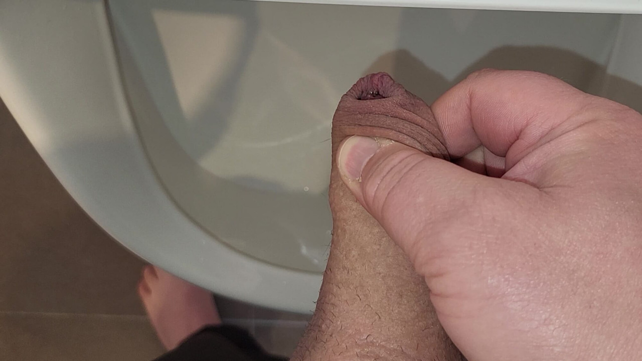 Man peeing in urinal
