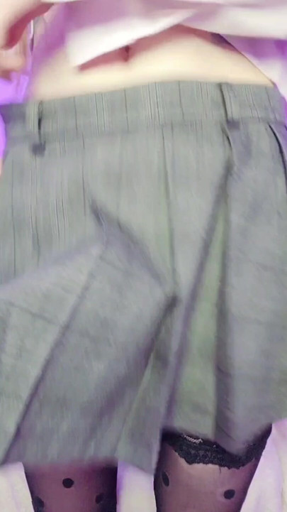 A t-girl's hard cock under a school skirt