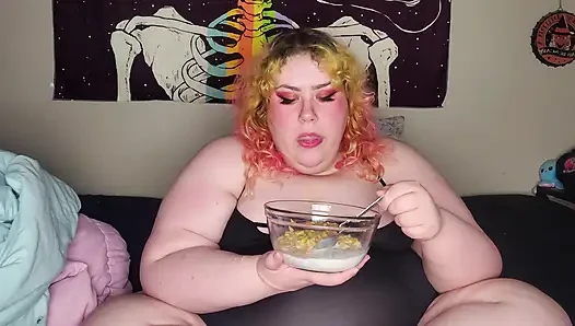 Fat woman eating frosted flakes