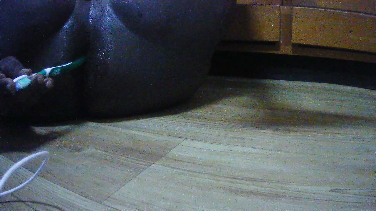 fucking my big black tight pussy with a  tooth brush