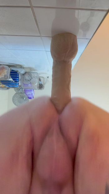 Taking big dildo in shower