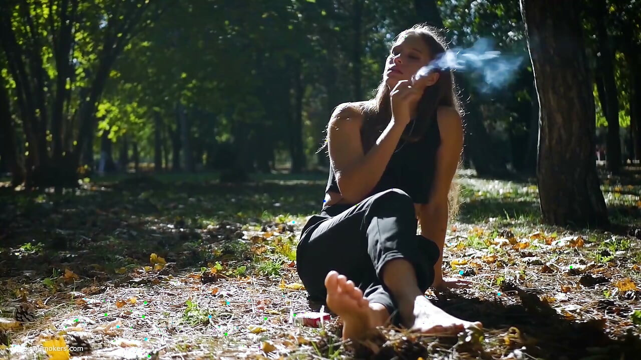 Seductive Russian Beauty Smoking Cigarette in Studio