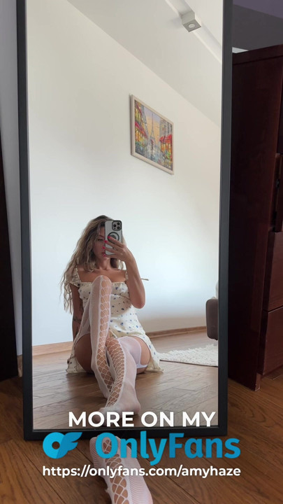 An innocent, cute girl is trying on sexy stockings for you