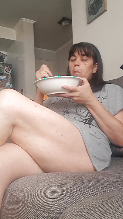 MILF Spreading Her Legs While Eating