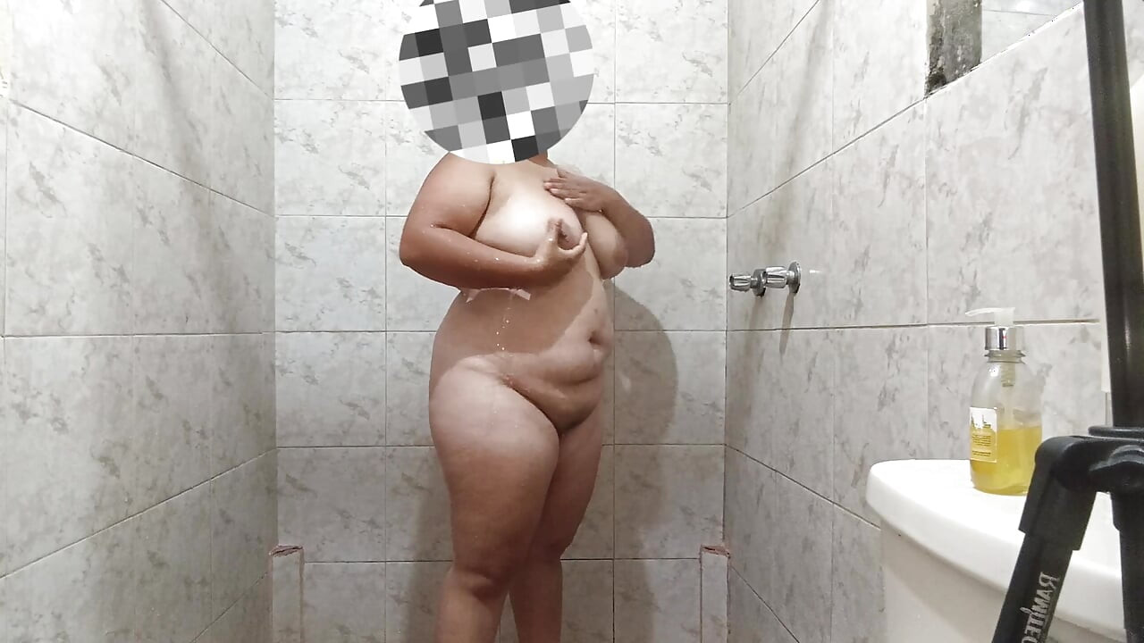 Sexy Latin girl touches herself very rich while showering rich and has giant breasts.