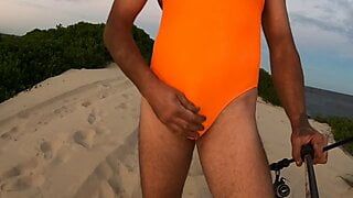 Orange one piece swimsuit down at the beach