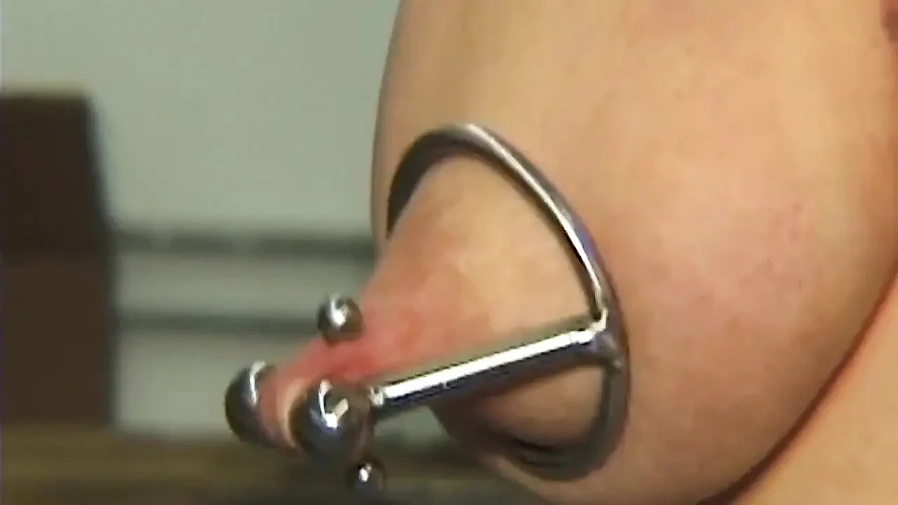 Redhead MILF Submits to Weighted Nipple Clamps