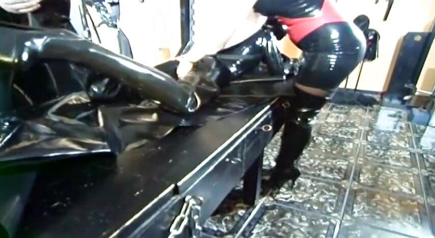 Extreme bondage for latex fetish slut