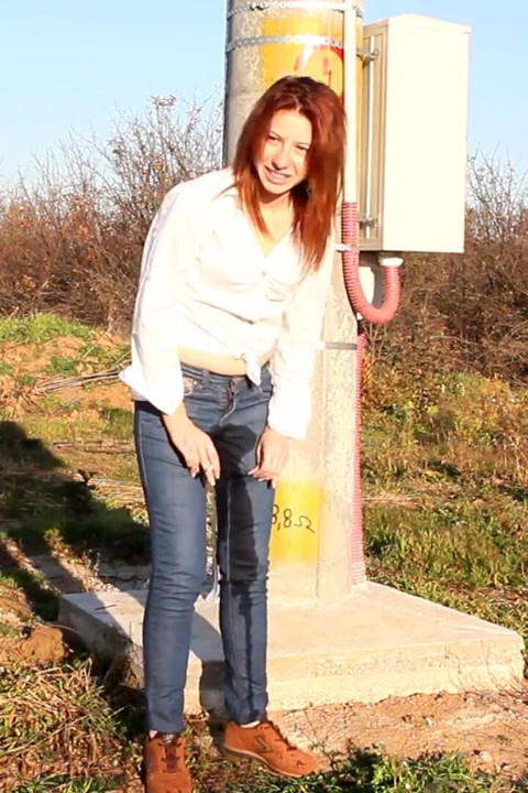 Wetting her jeans really well