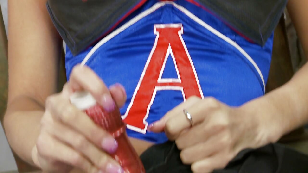 Cheerleader hottie shoves a fuck toy in her tight cunt