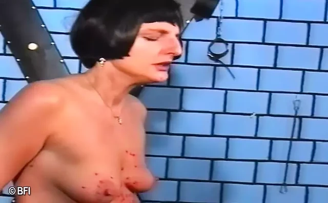 Two kinky females gets whipped and covered in wax