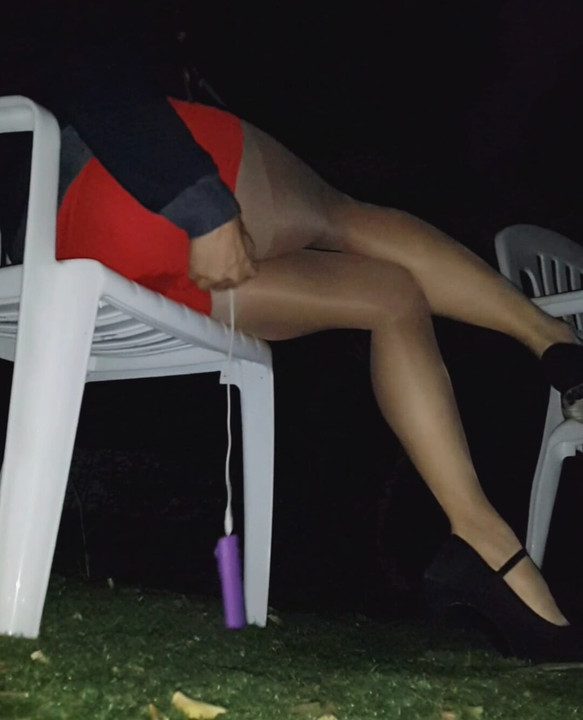 Young asian in tight red skirt, sheer pantyhose and highheels came to public park with vibrator inside. Control her with remote-