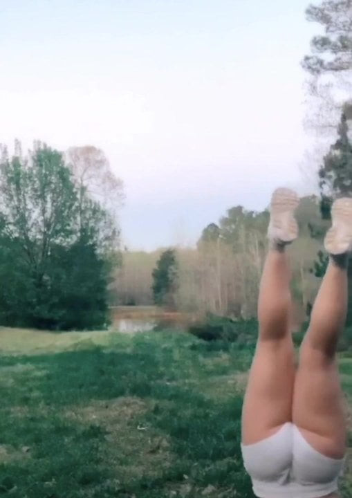 Sexy giggly ass doing walking handstand
