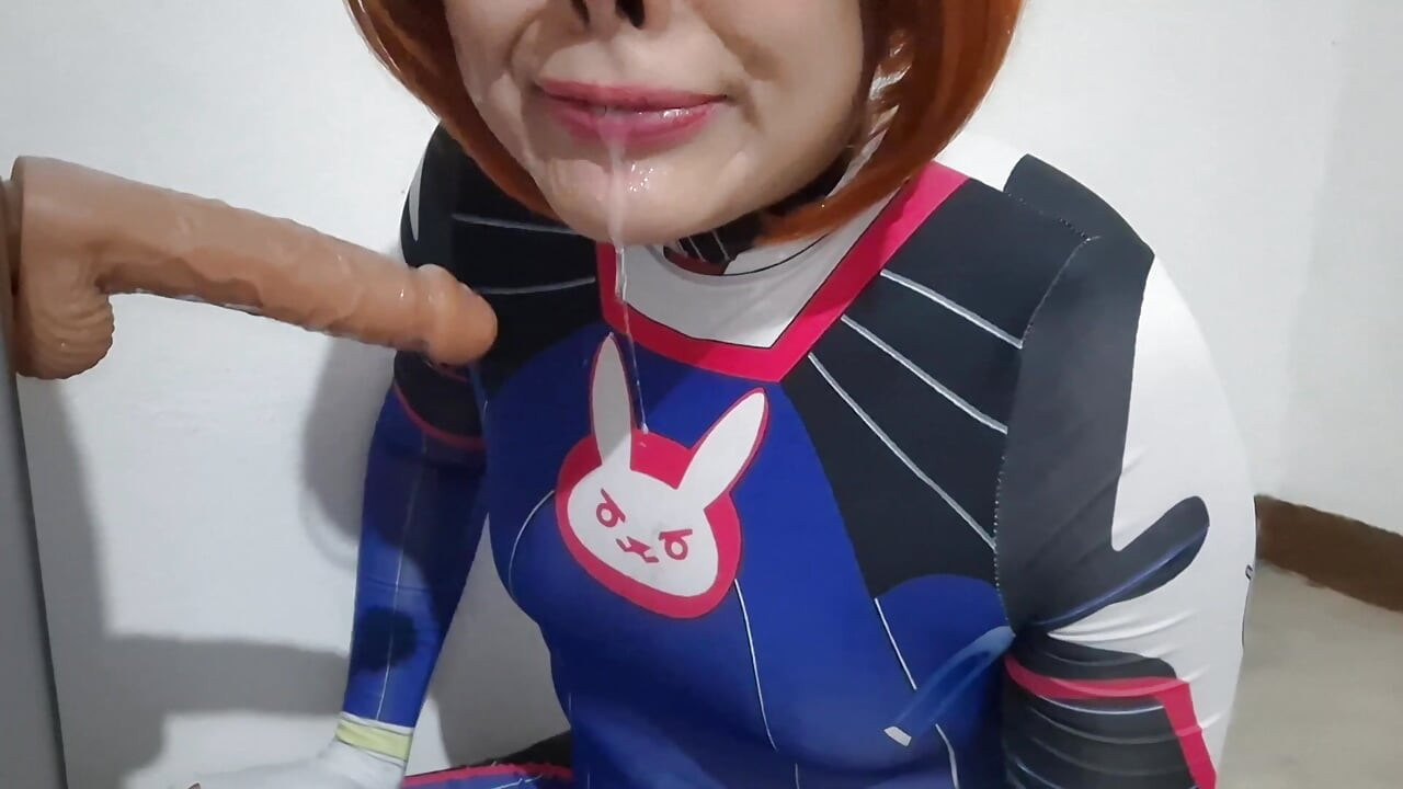Femboy with Dva Cosplay and BDSM Nosehook Giving a Blowjob, Eating Cum and Deepthroat to Big Dildo