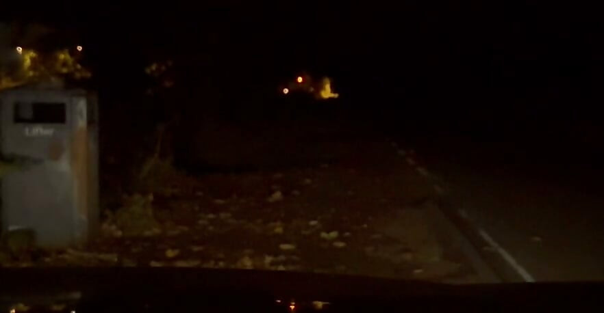 Interrupted while cutting off clothes , had to hide infront of car crouched down till car passed