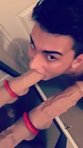 Andrew sucking on a small dildo