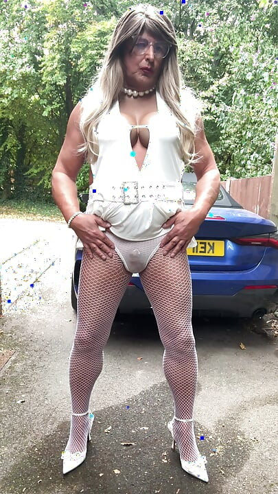 Sexy Crossdresser kellycd2022 in sexy white mini dress and fishnet pantyhose and heels