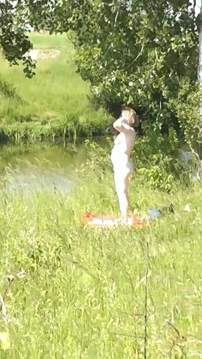 Thrilling moment from "Milf sexy woman sunbathing naked on river bank. Naked in public. Wild beach Nudist. Ass. Pussy."
