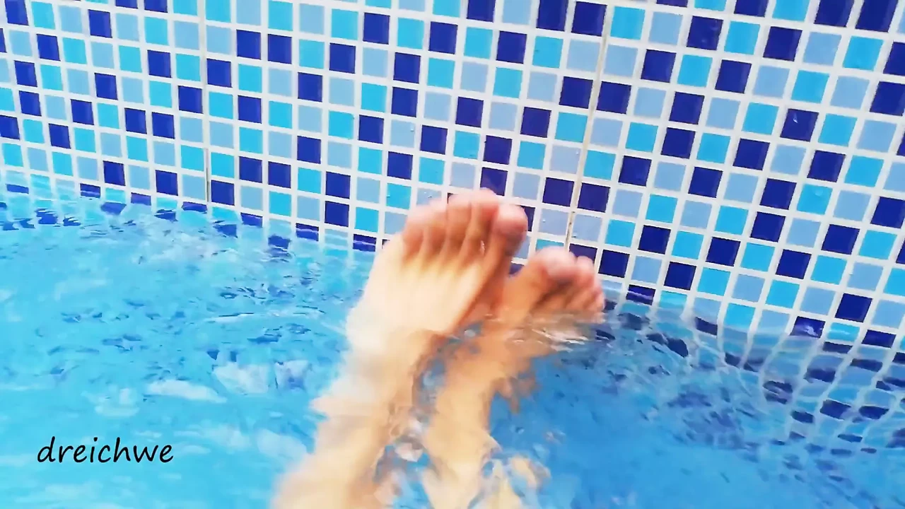 Feet in the pool with water