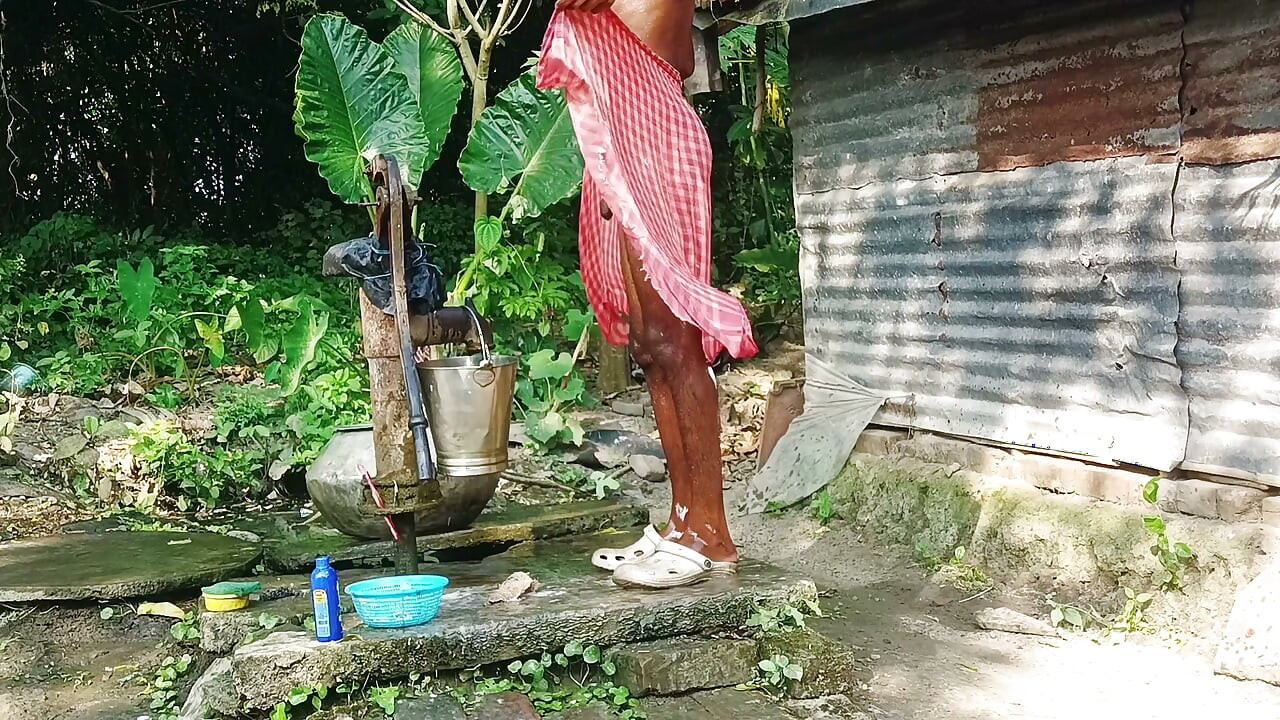 Desi young man bath Open place.
