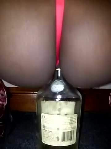 Slut Takes Bottle of Spirits Up Her Pussy