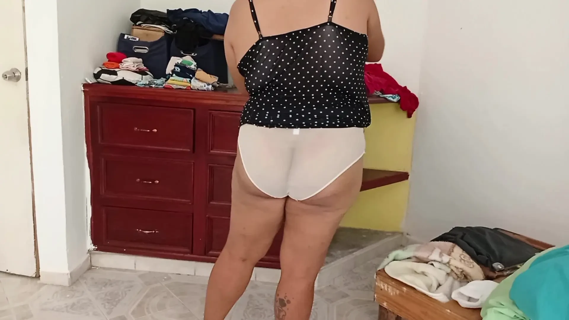 Chubby Mom Tidying Up Room And Folding Laundry 2