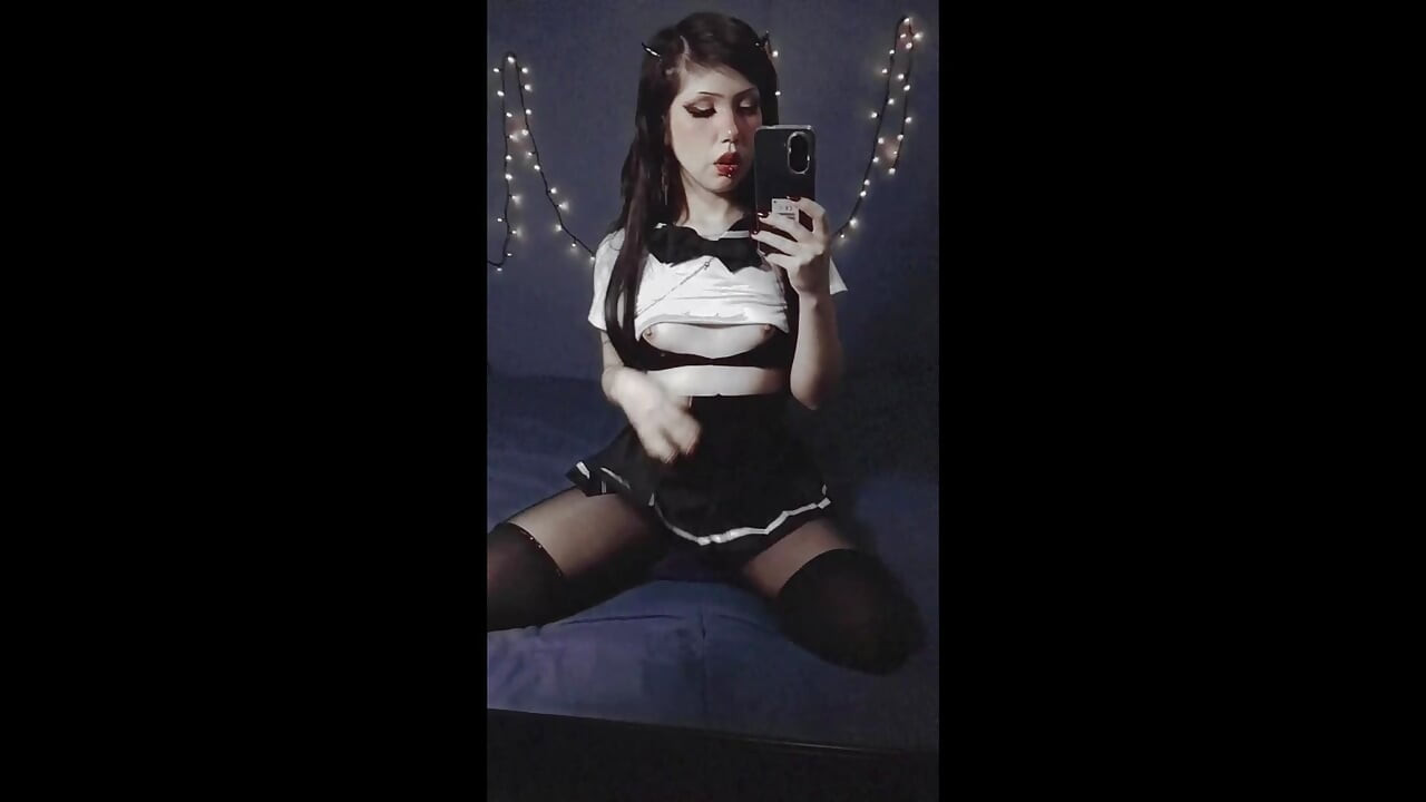 Gothic girl dressed as a Japanese schoolgirl with small tits and beautiful nipples