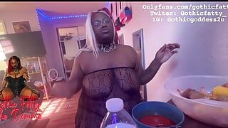 Ebony BBW stuffs her face while she is topless