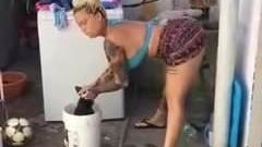 sexy lady dancing while washing clothes