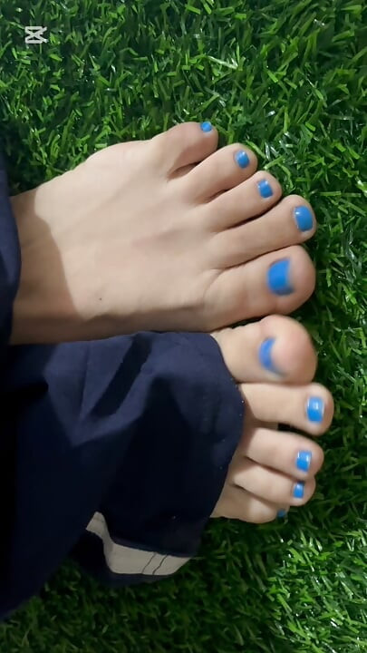 Dirty feet in grass