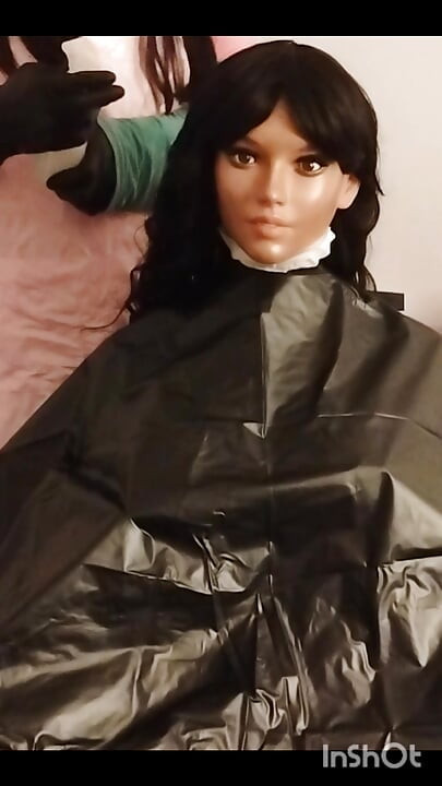 Ebony Sex doll Nikki shows off vinyl shampoo capes