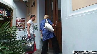 Busty blonde granny pleases young guy for help