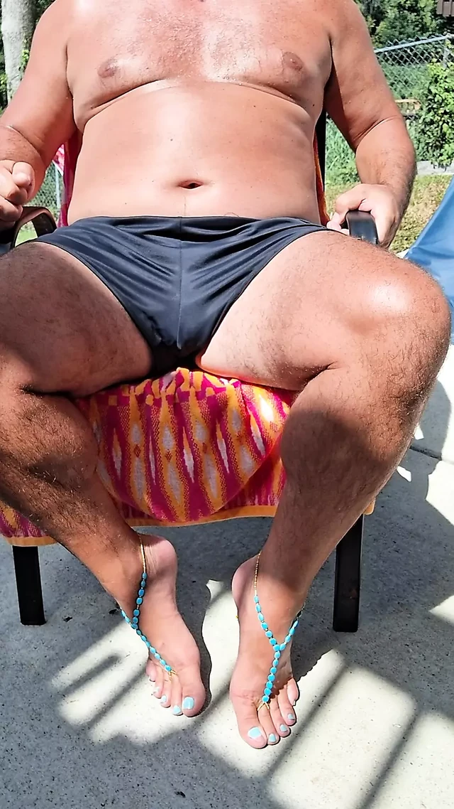Sitting in my back yard getting a tan while showing off my cock and Gf's barefoot sandals