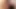 Sensual podcast story two lesbian bodies coming together on a small bed in a room with dimmed lights