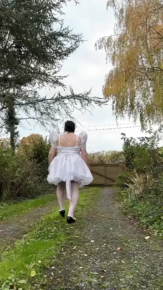 Dressed in a short wedding dress to play the maid for a day