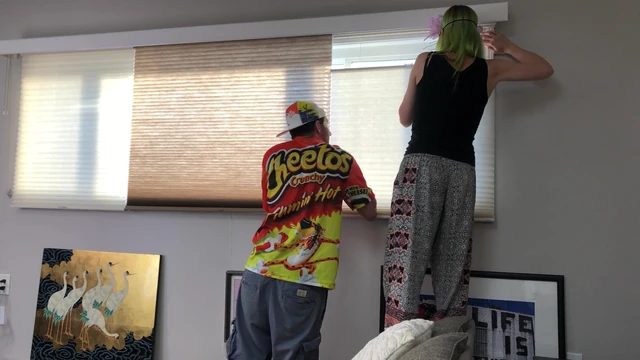 Couple Peeping Outside Apartment Window