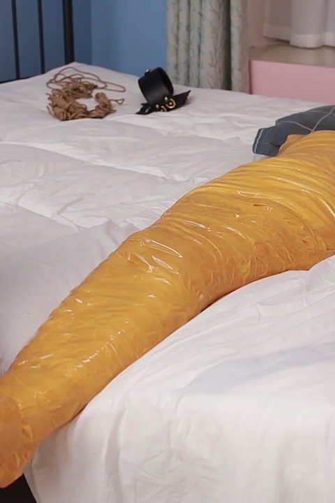 A Cute Barefoot Girlfriend Uses Tape to Bind Her Whole Body, Playing with Her Cute Bare Feet