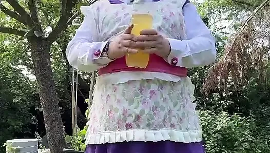 In gardener's clothes to take a piss shower outside fully dressed