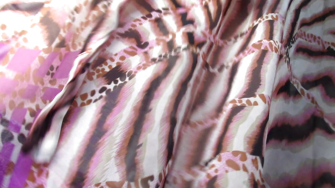 Amateur wife dancing naked at home. Amateur woman has fun trying on clothes and cutting them.