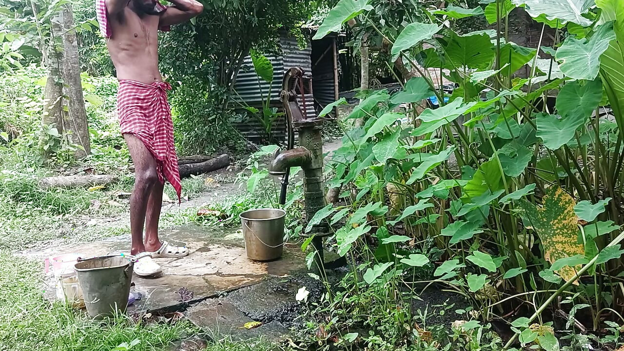 Tha naked Indian mature man shower in open place and showing body and dick..
