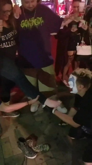 Clown Having Some Feet On His Face