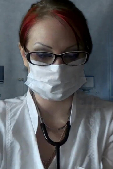 Doctor eating in medical mask and gloves