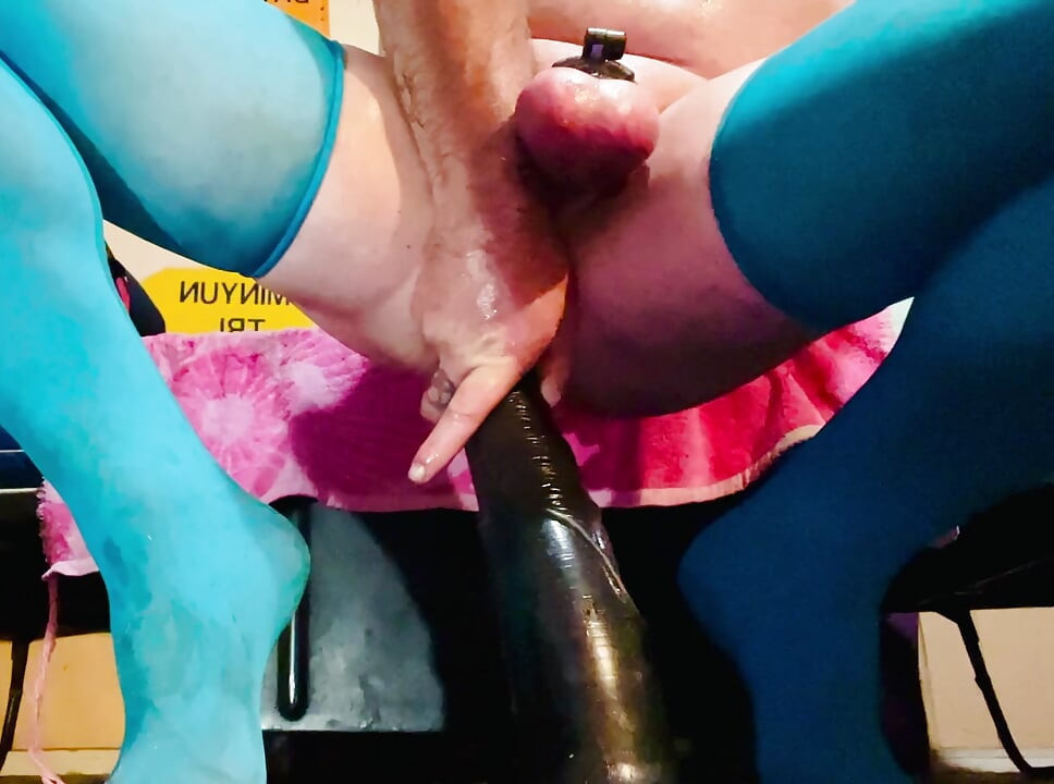 Crossdressing slut gets off riding on her huge toys