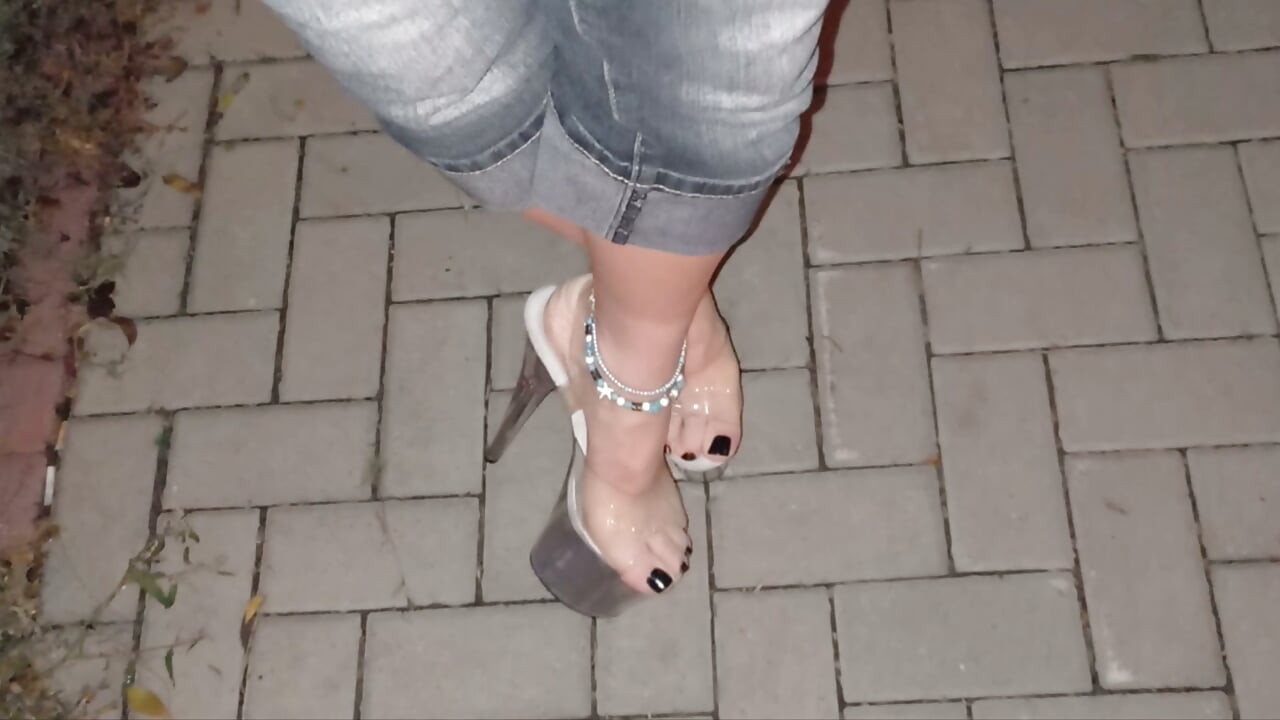 nighttime crossdressing on a public street in 20cm stripper heels, black toes, and black claws