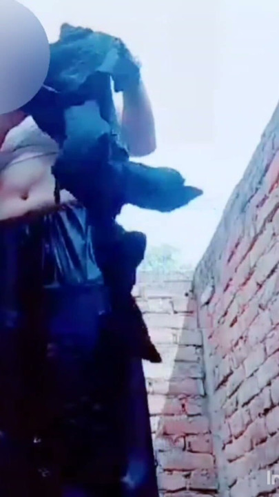 A very beautiful girl was taking bath in her courtyard | Clip 1