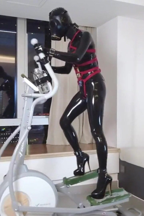 Mz27 - a Girl Bound in Latex Walks on a Treadmill