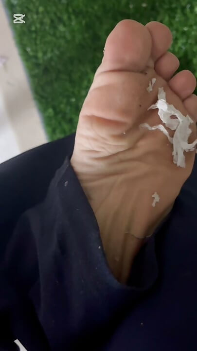 Dirty feet in grass