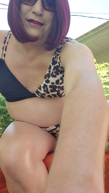 It's a beautiful day to sunbathe in the backyard!