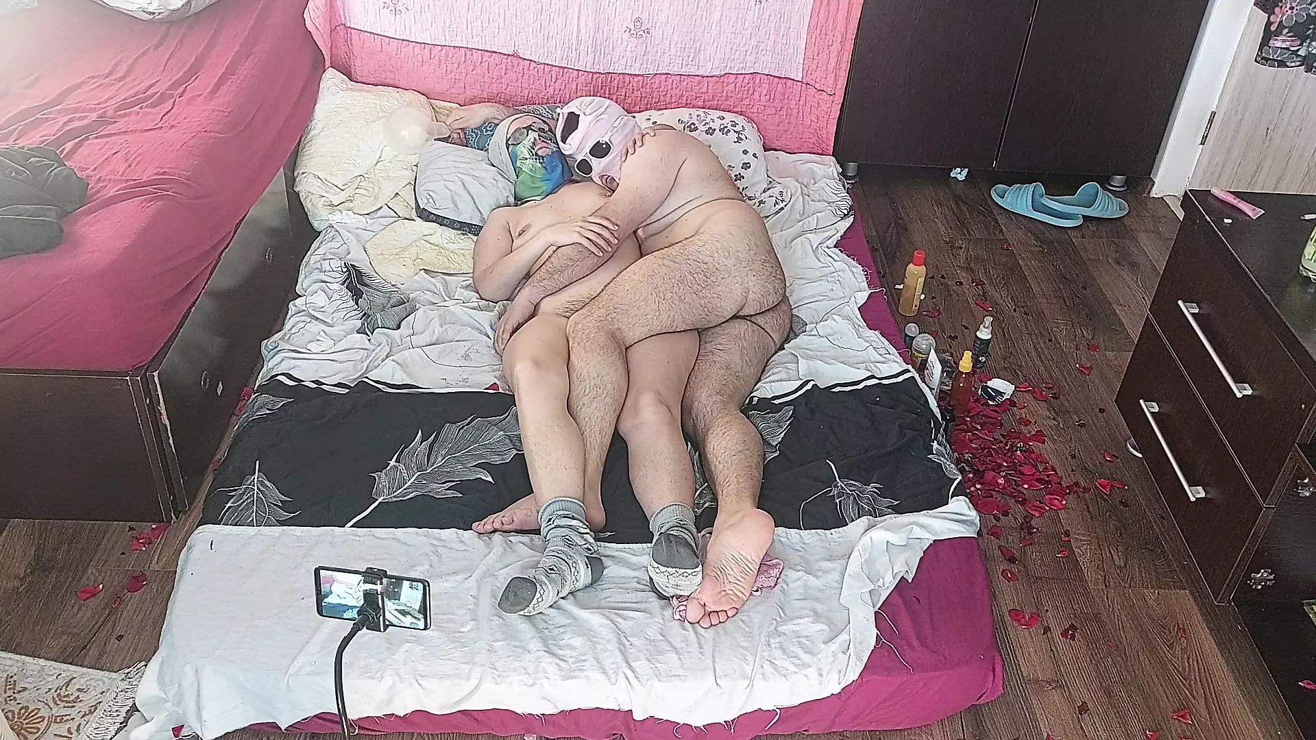 Sensual massage of a hot couple with oil on the body. Foreplay in the bedroom with an amateur couple.